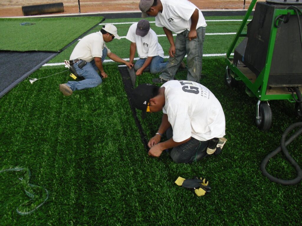 artificial turf installation team seaming process